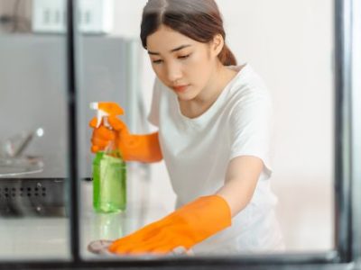 Beautiful Asian woman cleaning the kitchen area